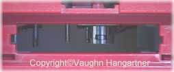 Image of the tape hatch on the late WOW/Playskool Teddy Ruxpin. -Image-