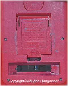 Image of the back showing the start button, battery hatch and tape hatch on the late WOW/Playskool Teddy Ruxpin. -Image-